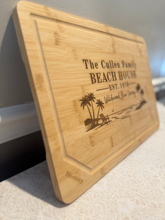 Wooden cutting board with engraved text and design on a white surface