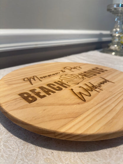Wooden coaster with engraved text on a light surface